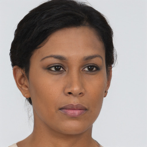 Neutral black young-adult female with short  brown hair and brown eyes