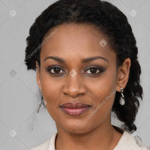 Joyful black young-adult female with medium  black hair and brown eyes