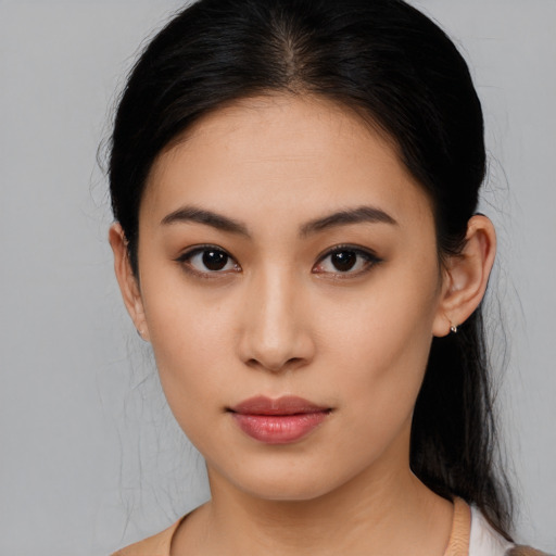 Neutral asian young-adult female with medium  brown hair and brown eyes