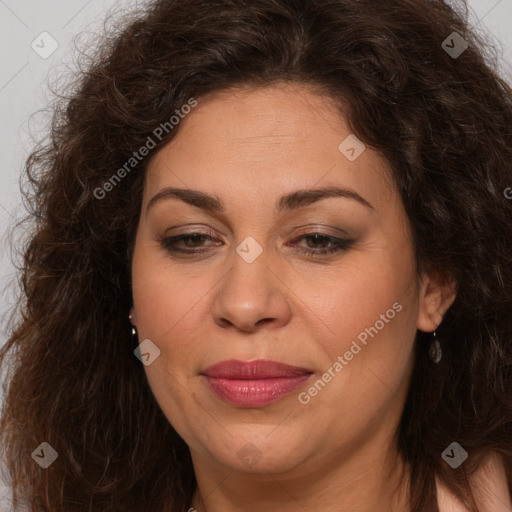 Joyful white adult female with long  brown hair and brown eyes