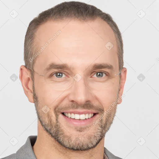 Joyful white adult male with short  brown hair and grey eyes