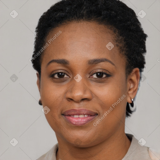 Joyful black young-adult female with short  brown hair and brown eyes