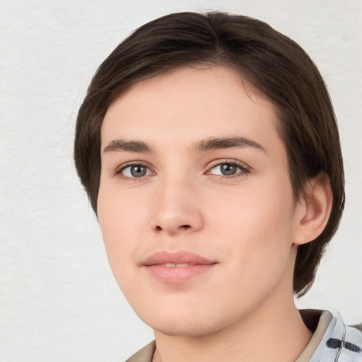 Neutral white young-adult female with short  brown hair and brown eyes