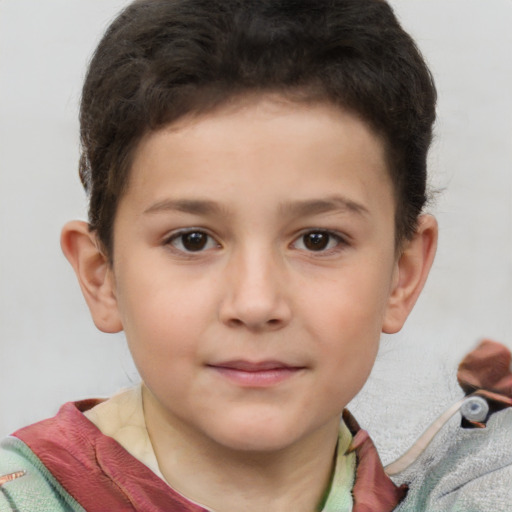 Joyful white child male with short  brown hair and brown eyes