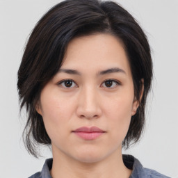 Neutral asian young-adult female with medium  brown hair and brown eyes