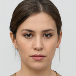 Neutral white young-adult female with medium  brown hair and brown eyes