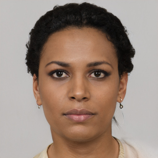 Neutral black young-adult female with short  black hair and brown eyes