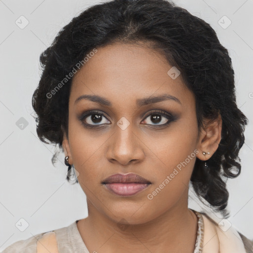 Joyful black young-adult female with long  brown hair and brown eyes