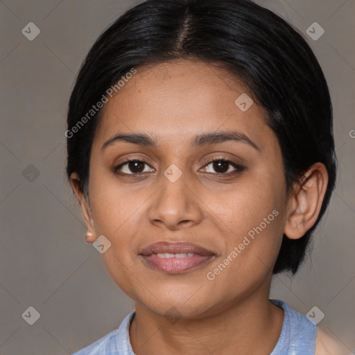 Joyful latino young-adult female with medium  brown hair and brown eyes