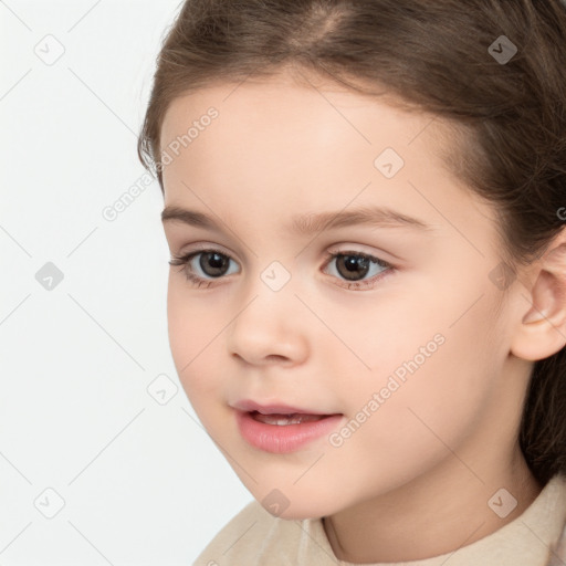 Joyful white child female with medium  brown hair and brown eyes