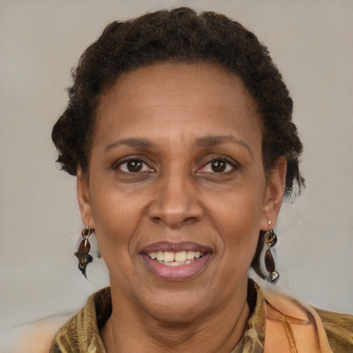 Joyful latino adult female with short  brown hair and brown eyes