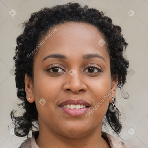 Joyful black young-adult female with long  brown hair and brown eyes