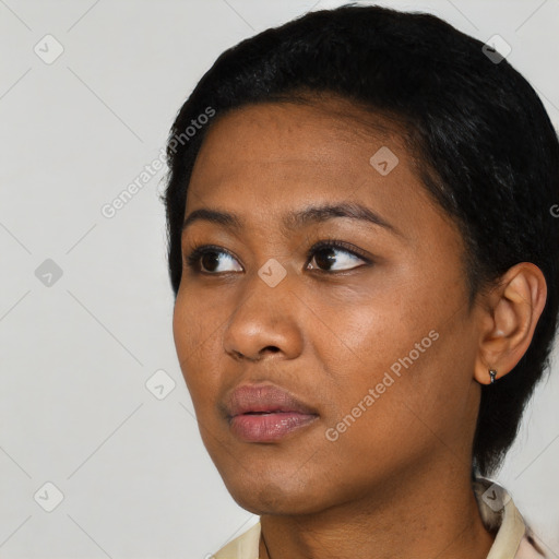 Neutral black young-adult female with short  black hair and brown eyes