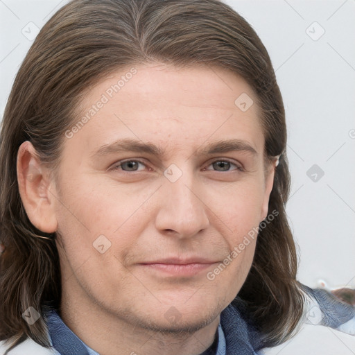 Joyful white young-adult male with medium  brown hair and grey eyes