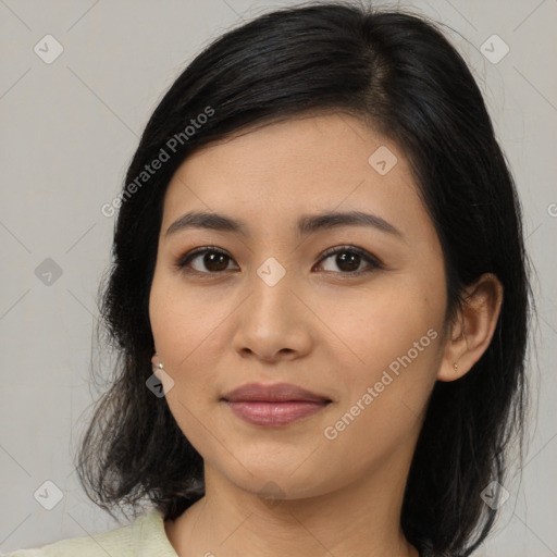 Joyful asian young-adult female with medium  black hair and brown eyes