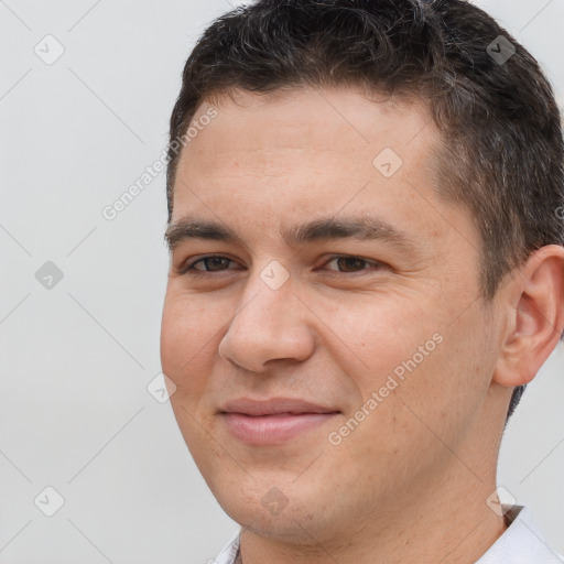 Joyful white young-adult male with short  brown hair and brown eyes