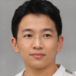 Neutral asian young-adult male with short  brown hair and brown eyes