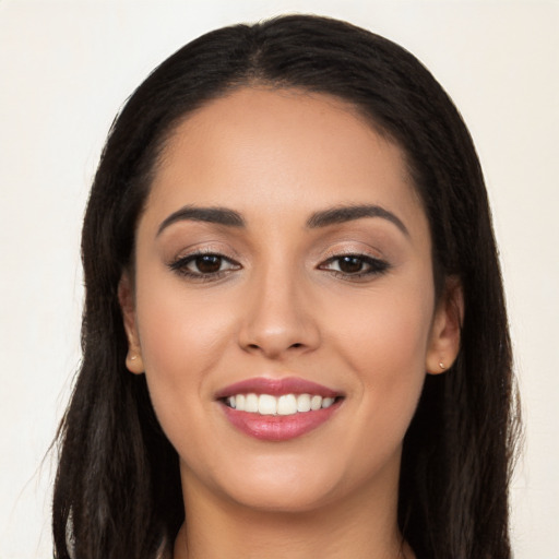 Joyful white young-adult female with long  black hair and brown eyes