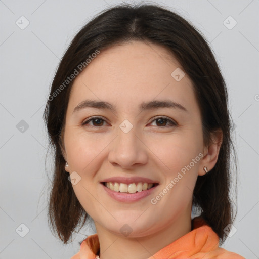 Joyful white young-adult female with medium  brown hair and brown eyes