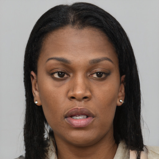 Neutral black young-adult female with long  brown hair and brown eyes
