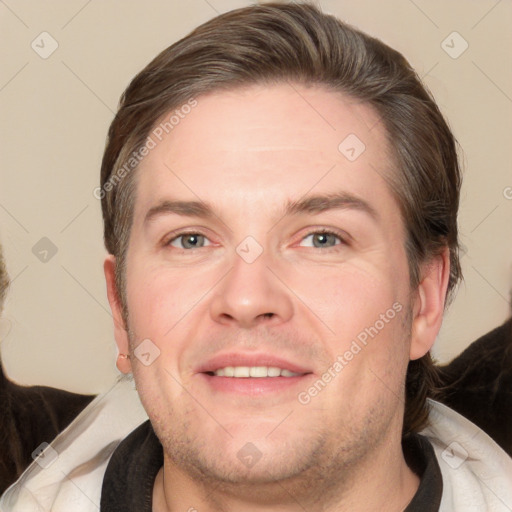 Joyful white adult male with short  brown hair and grey eyes