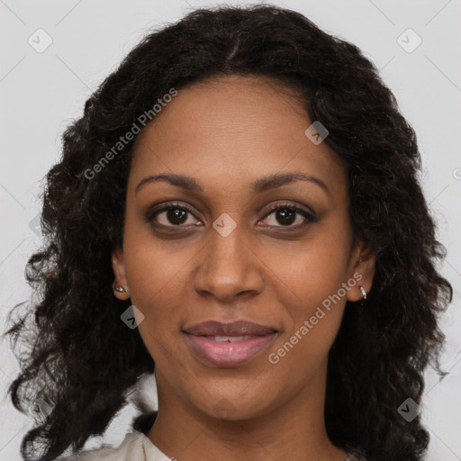 Joyful black adult female with medium  brown hair and brown eyes