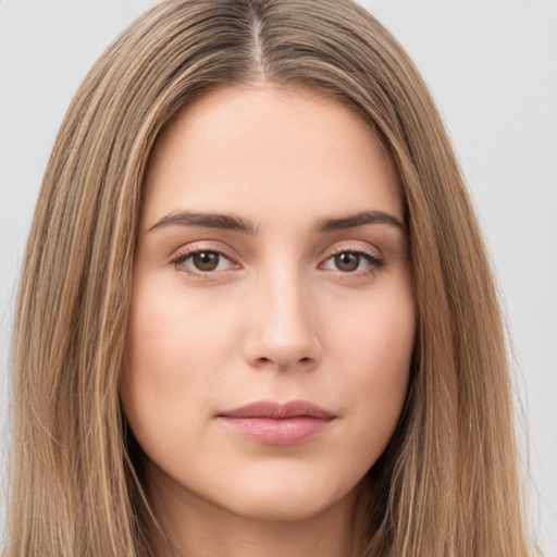 Neutral white young-adult female with long  brown hair and brown eyes