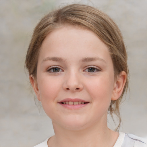 Joyful white child female with medium  brown hair and grey eyes