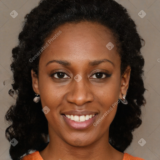 Joyful black young-adult female with long  brown hair and brown eyes