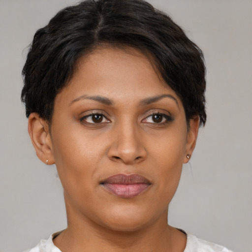 Joyful asian young-adult female with short  brown hair and brown eyes