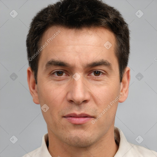 Joyful white adult male with short  brown hair and brown eyes