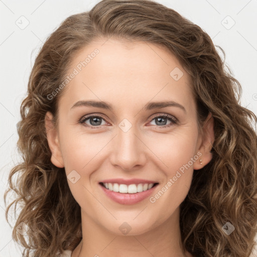 Joyful white young-adult female with long  brown hair and green eyes