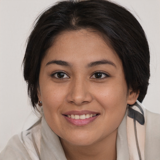 Joyful asian young-adult female with medium  brown hair and brown eyes