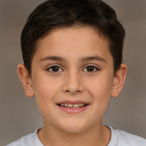 Joyful white child female with short  brown hair and brown eyes