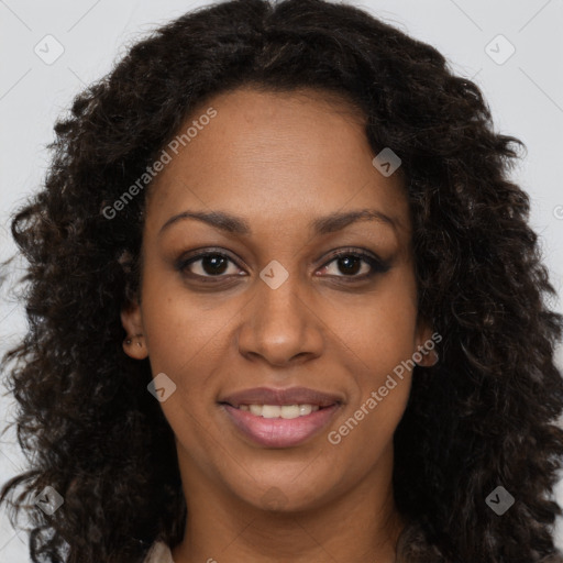 Joyful black young-adult female with long  brown hair and brown eyes