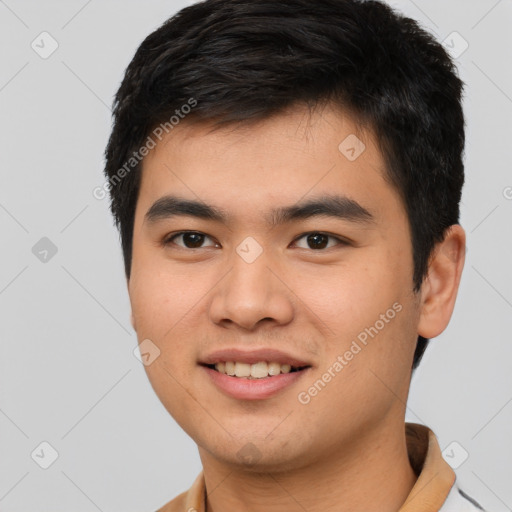 Joyful white young-adult male with short  black hair and brown eyes