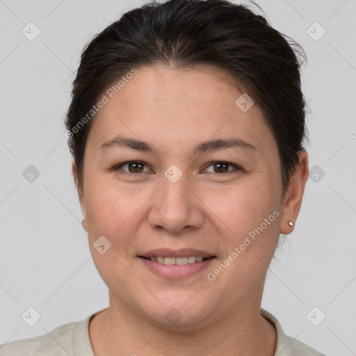 Joyful white adult female with short  brown hair and brown eyes