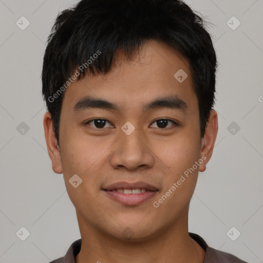 Joyful asian young-adult male with short  black hair and brown eyes