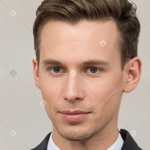 Neutral white young-adult male with short  brown hair and grey eyes