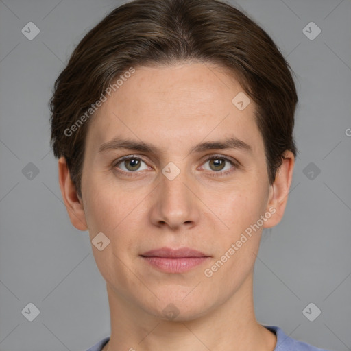 Joyful white young-adult female with short  brown hair and grey eyes