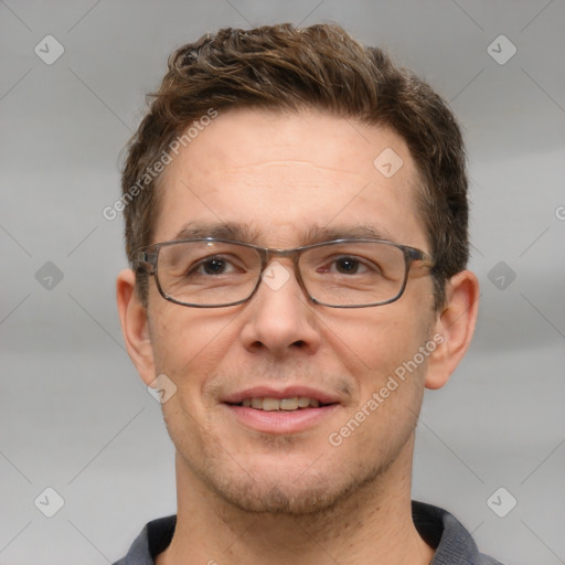 Joyful white adult male with short  brown hair and grey eyes