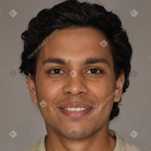 Joyful black young-adult male with short  brown hair and brown eyes