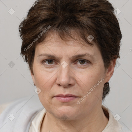 Joyful white adult female with short  brown hair and brown eyes