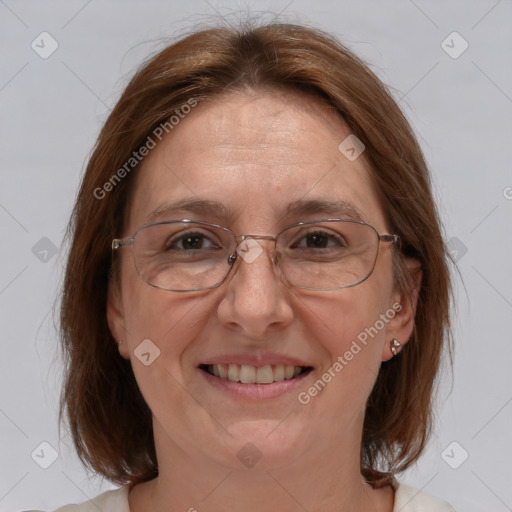 Joyful white adult female with medium  brown hair and brown eyes