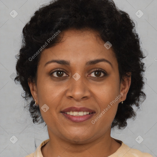 Joyful black adult female with medium  brown hair and brown eyes