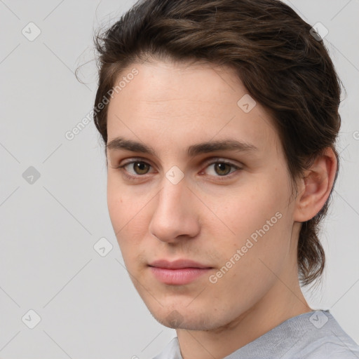 Joyful white young-adult male with medium  brown hair and brown eyes