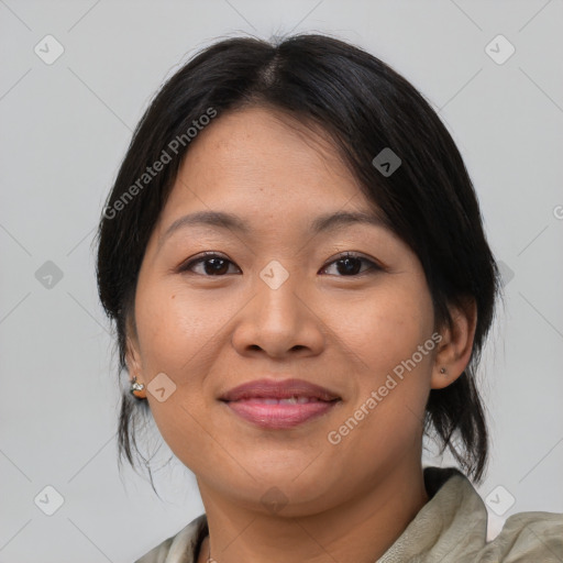 Joyful asian young-adult female with medium  brown hair and brown eyes