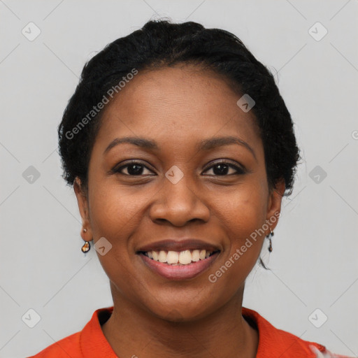 Joyful black young-adult female with short  black hair and brown eyes