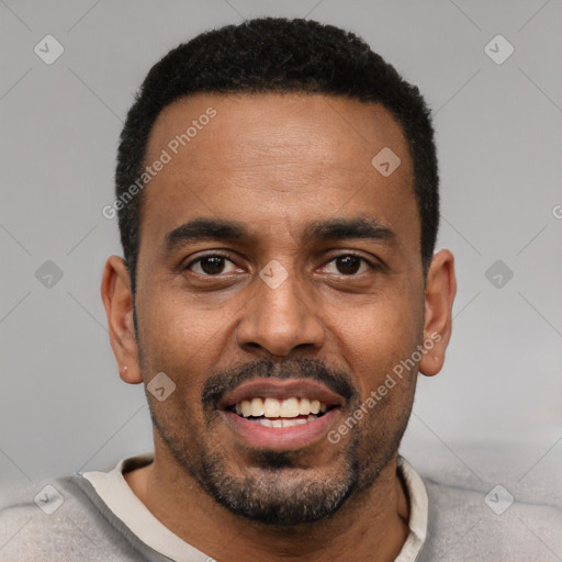 Joyful black young-adult male with short  black hair and brown eyes