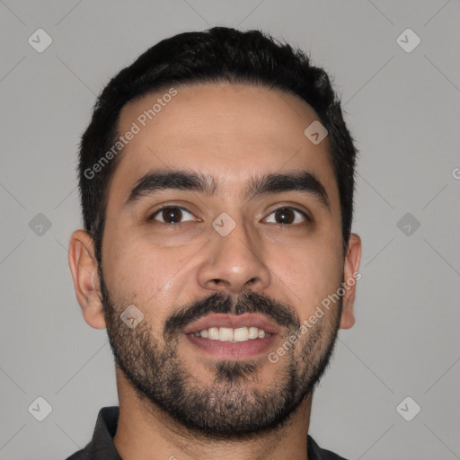 Joyful latino young-adult male with short  black hair and brown eyes